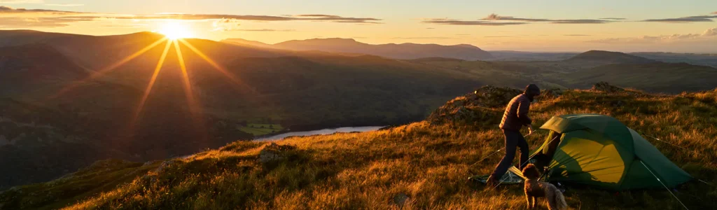 A hiker enjoying 'green travel 'in the Lake District.