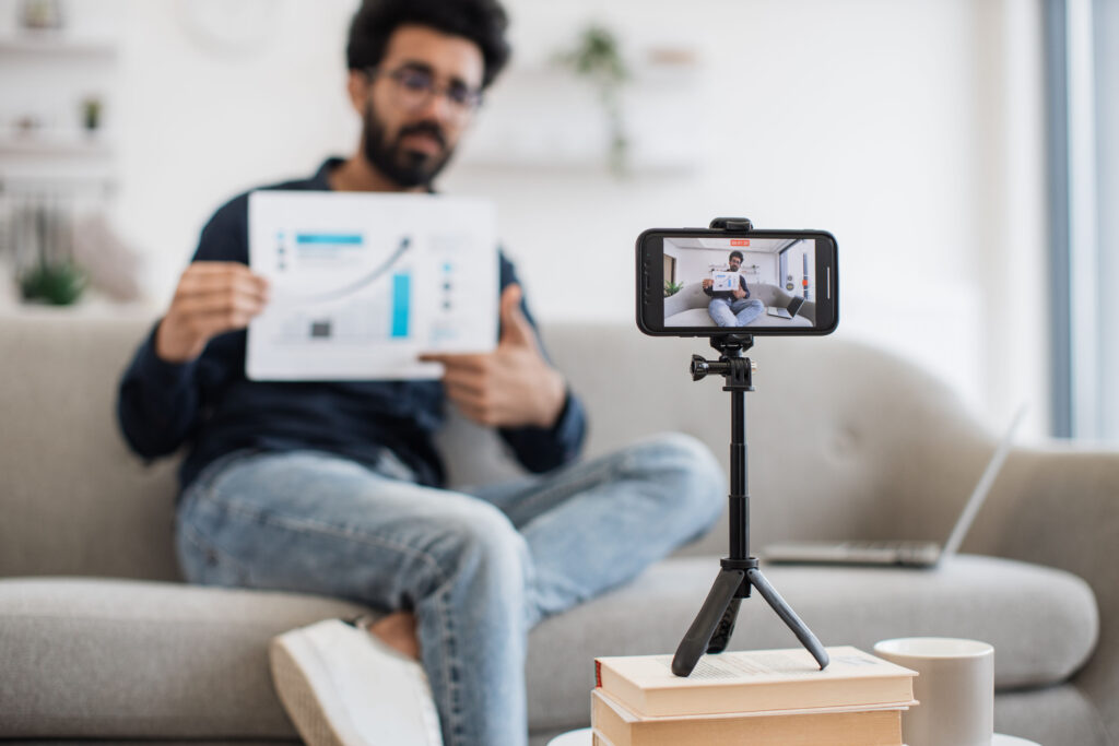 finfluencer giving financial advice using mobile device